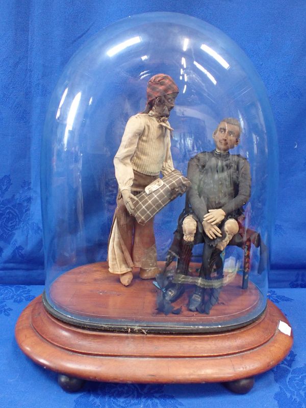 A 19TH CENTURY MODEL OF TWO FIGURES UNDER A GLASS DOME