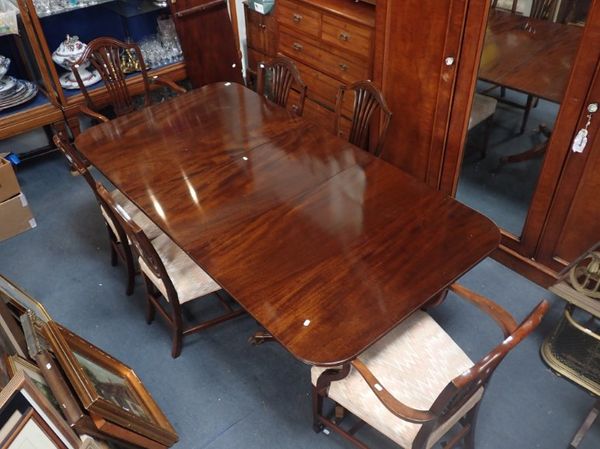 A WILLIAM TILLMAN MAHOGANY TWIN PILLAR DINING TABLE