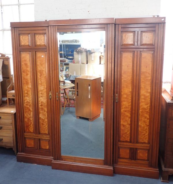 A LARGE WALNUT AND SATINWOOD BREAKFRONT WARDROBE