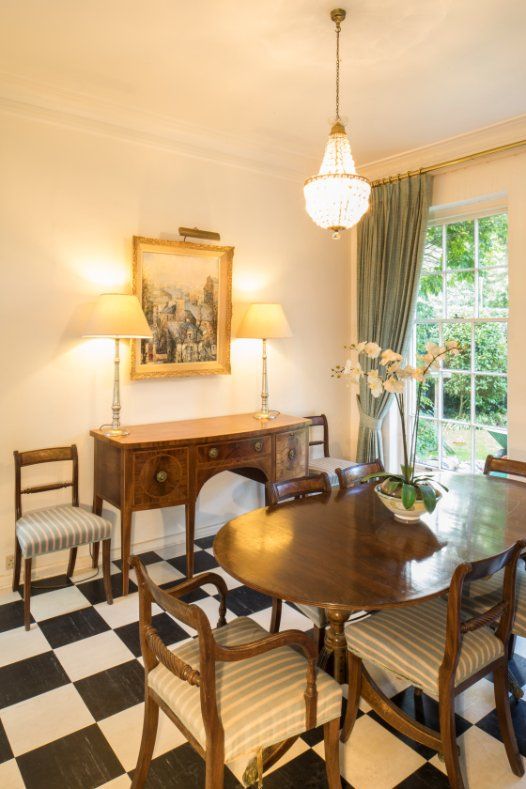 A REGENCY STYLE MAHOGANY TWIN-PEDESTAL DINING TABLE