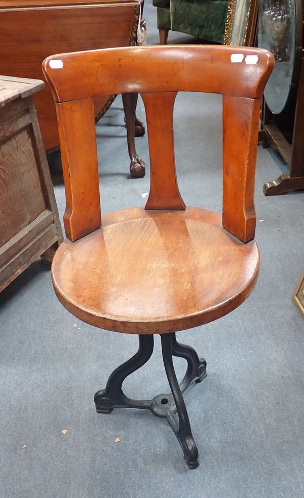 A SHIP'S SWIVEL CHAIR, WITH CAST IRON BASE