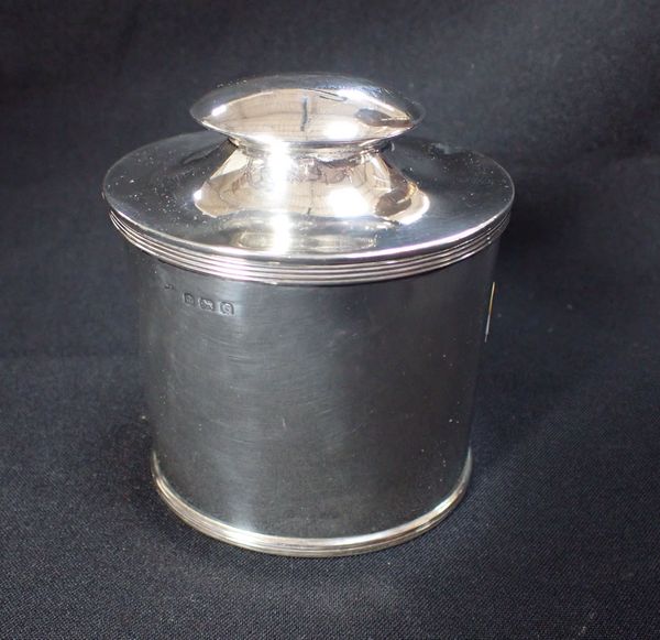 A GEORGE V SILVER OVAL TEA CADDY