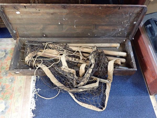 A VINTAGE BADMINTON NET AND POSTS