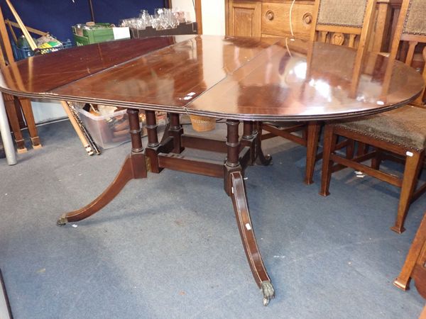 A REPRODUCTION MAHOGANY DROP LEAF TABLE