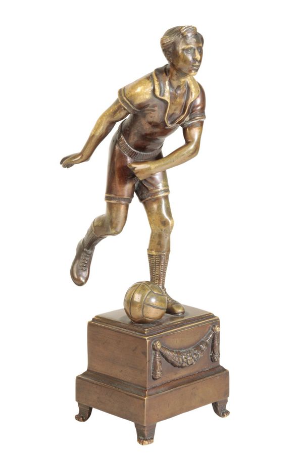 A CONTINENTAL BRONZE MODEL OF A FOOTBALLER,