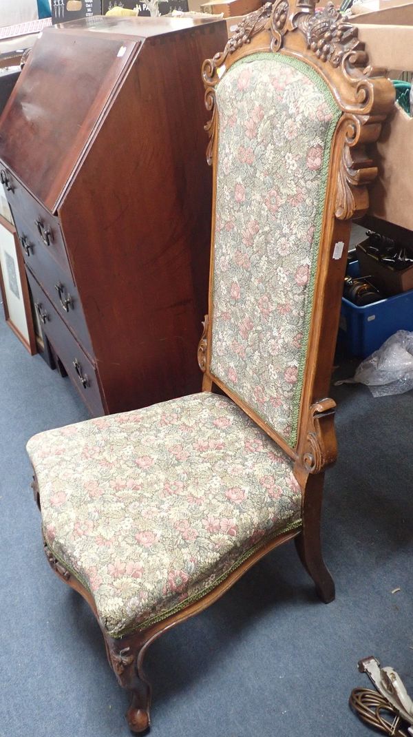 A VICTORIAN CARVED WALNUT NURSING CHAIR