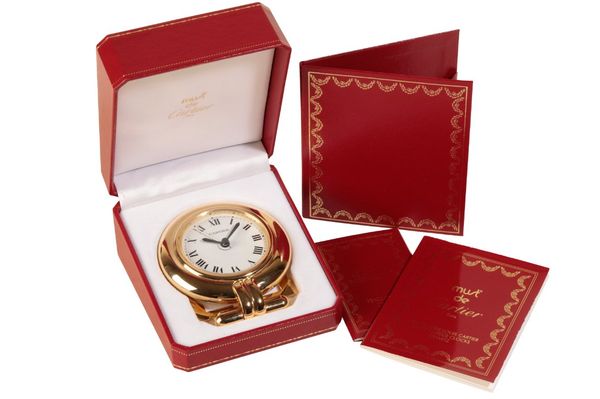 A CARTIER COLISEE GOLD PLATED DESK CLOCK