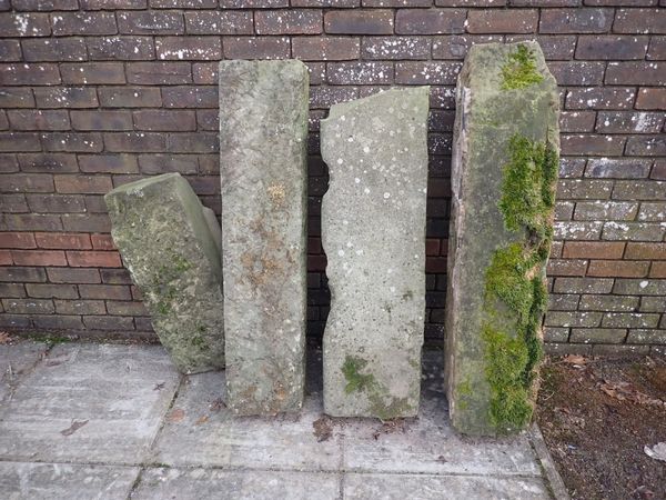 A GROUP OF FOUR STONE SLABS OR LINTELS