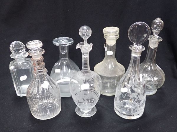 A COLLECTION OF GLASS DECANTERS
