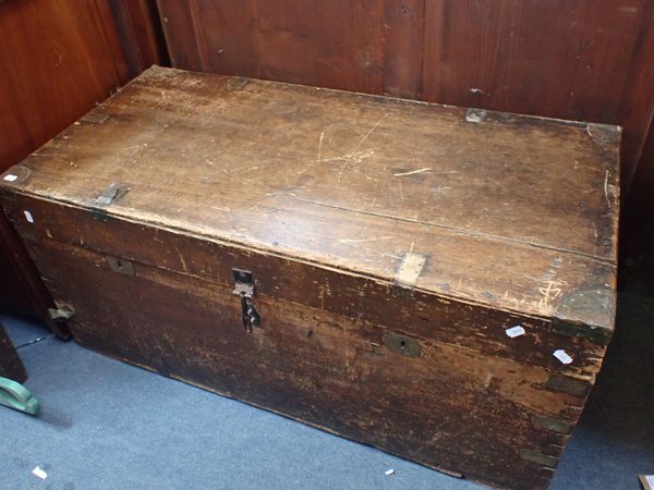 A LARGE WOODEN TRAVELLING TRUNK