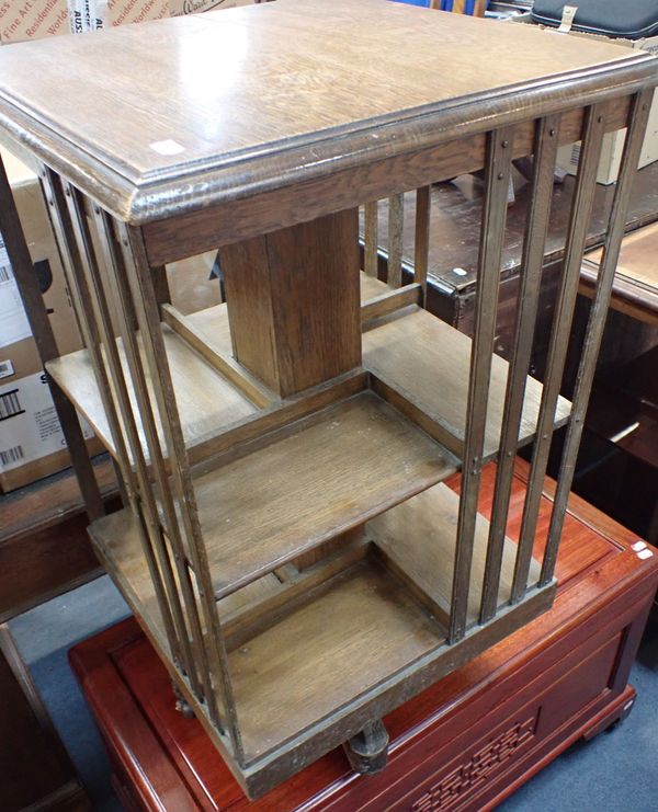 AN EDWARDIAN OAK REVOLVING BOOKCASE