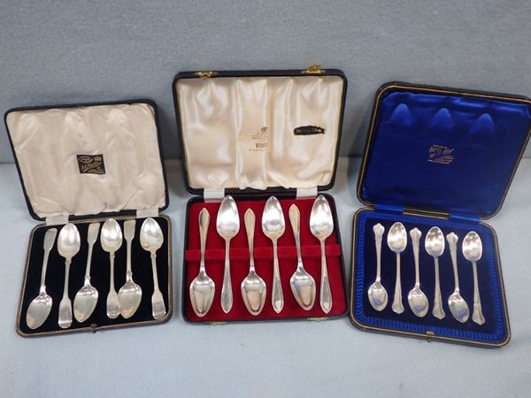 TWO SETS OF SILVER TEASPOONS