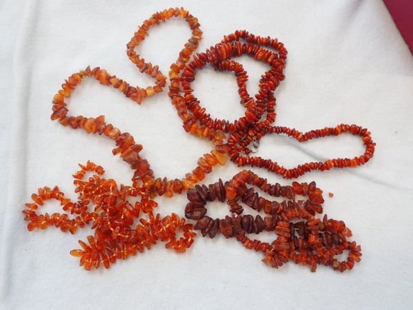 A COLLECTION OF AMBER NECKLACES (4)