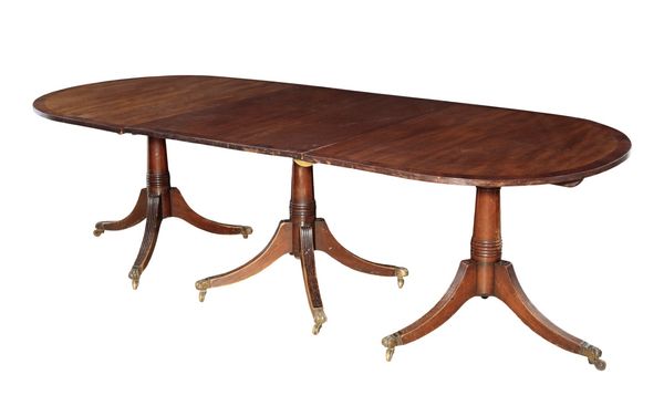 A MAHOGANY THREE PILLAR DINING TABLE