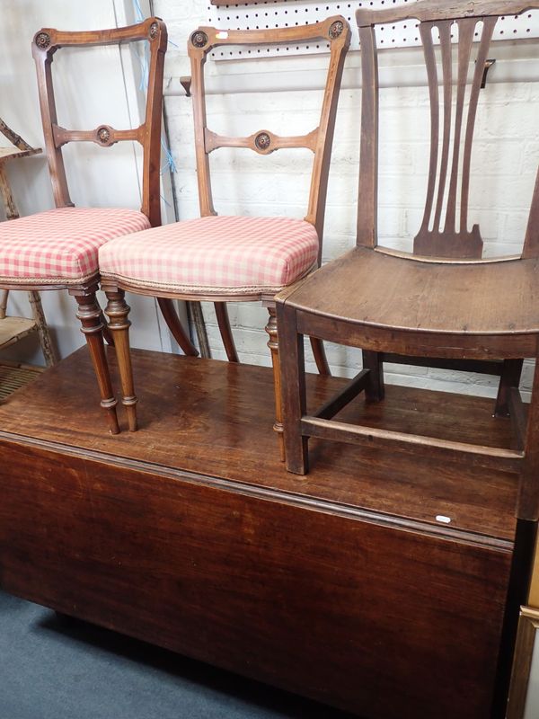 A  19TH CENTURY MAHOGANY DROP-LEAF DINING TABLE