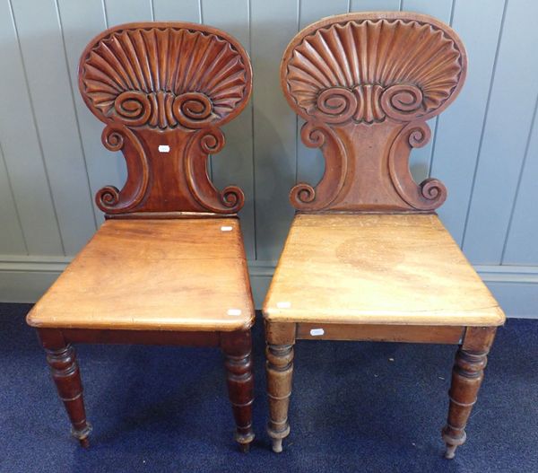 A PAIR OF EARLY VICTORIAN MAHOGANY SCALLOP-BACK HALL CHAIRS