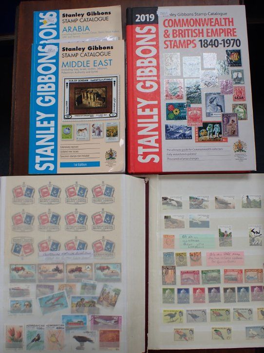 TWO ALBUMS OF UK, COMMONWEALTH AND WORLD STAMPS