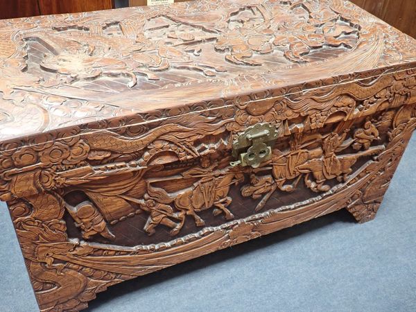 A CHINESE CAMPHOR WOOD CARVED CHEST