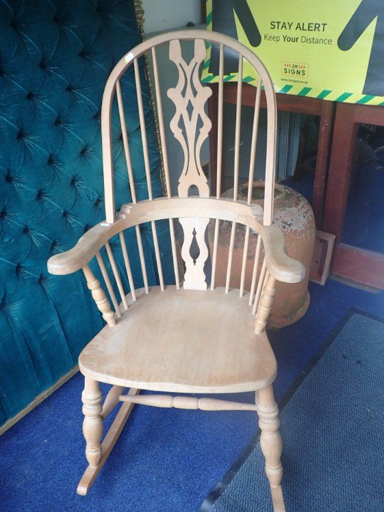 A MODERN BEECHWOOD HOOP-BACK WINDSOR ROCKING CHAIR