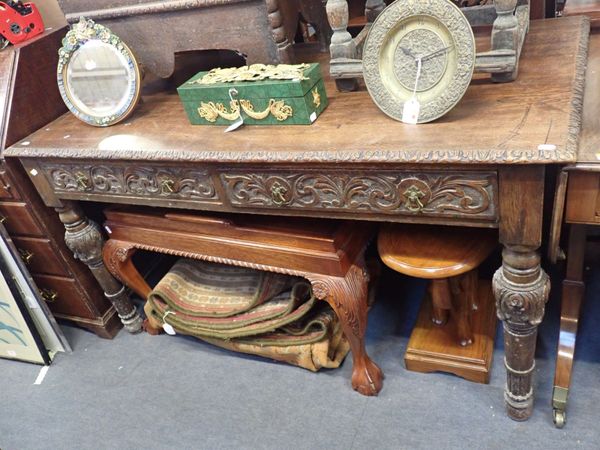 A VICTORIAN CARVED OAK CENTRE TABLE