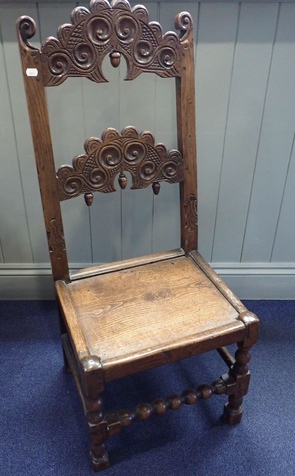 AN OAK HALL CHAIR, IN THE DERBYSHIRE STYLE