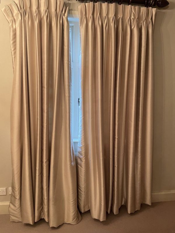 A PAIR OF CREAM SATIN TWO-TONE CURTAINS WITH POLE