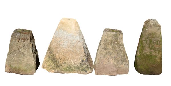 A GROUP OF FOUR STADDLE STONE BASES