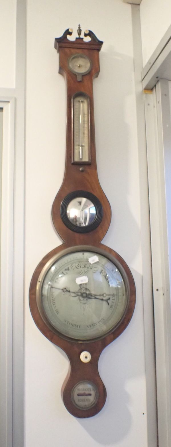 A 19TH CENTURY WHEELED BAROMETER