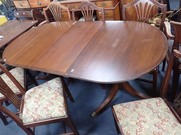 A REPRODUCTION MAHOGANY TWIN-PILLAR DINING TABLE