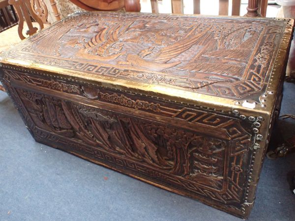 A PROFUSELY CARVED CAMPHORWOOD TRUNK