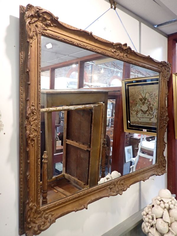 A 19TH CENTURY STYLE GILT FRAMED WALL MIRROR