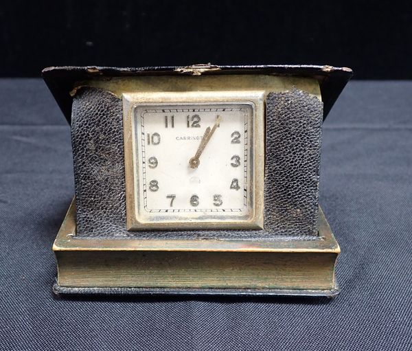 A NOVELTY TRAVEL CLOCK BY CARRINGTON