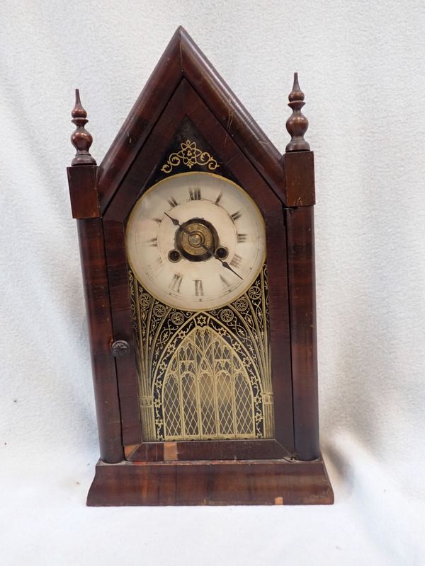 AN AMERICAN MAHOGANY CASED 'STEEPLE' SHELF CLOCK BY JEROME & CO.