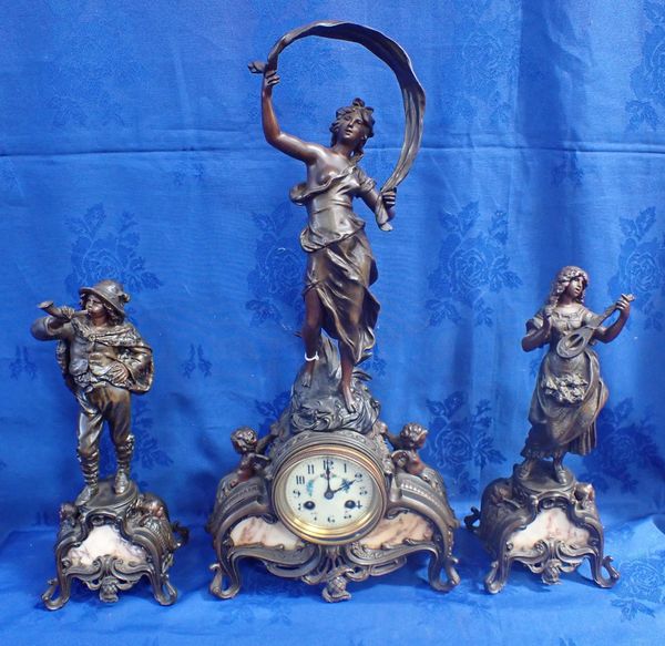 A LATE 19TH CENTURY FRENCH BRONZED SPELTER CLOCK GARNITURE