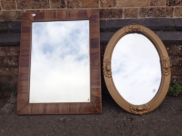 AN EDWARDIAN ROSEWOOD VENEERED SHALLOW CUSHION FRAMED MIRROR