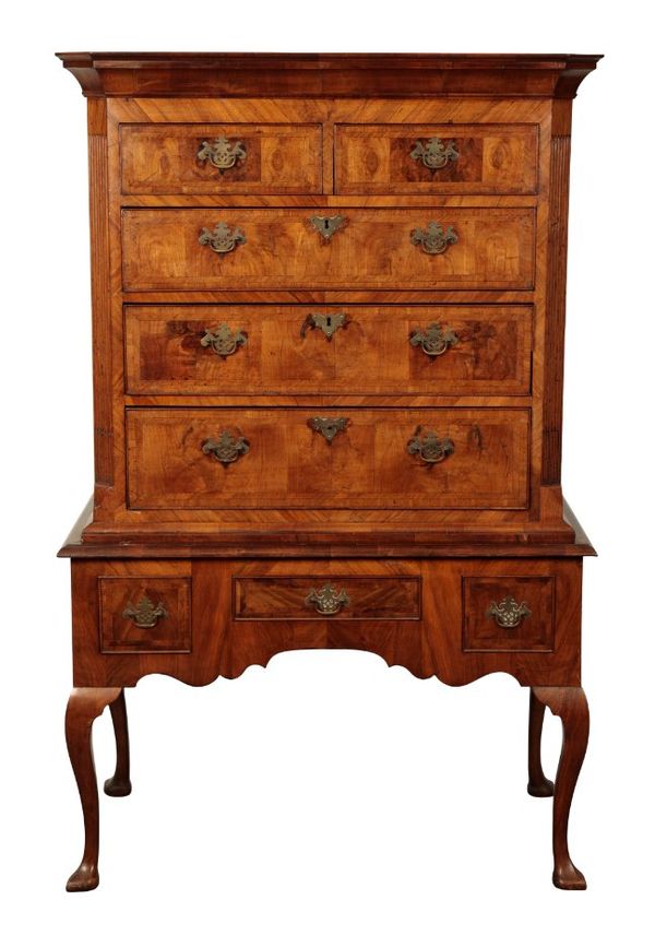 A GEORGE I WALNUT CHEST ON STAND