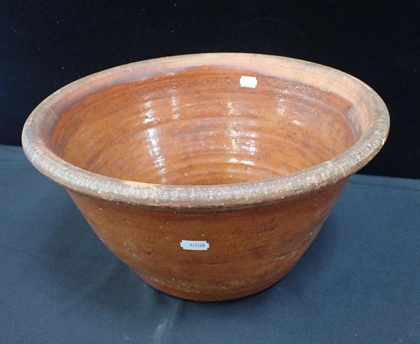 A COUNTRY POTTERY DAIRY BOWL