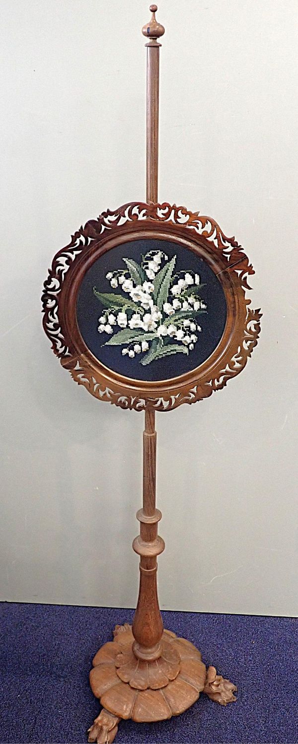 AN EARLY VICTORIAN ROSEWOOD POLE SCREEN