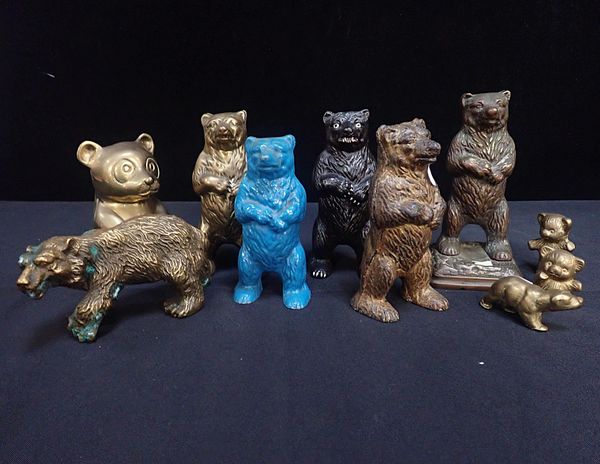 A GROUP OF BEAR SHAPED METAL MONEY BOXES