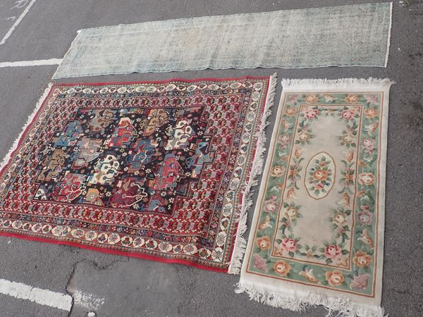A MACHINE-MADE RUG OF PERSIAN DESIGN