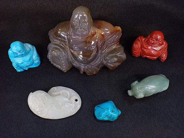 A CARVED HARDSTONE BUDDHA