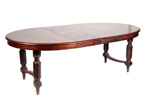 A FRENCH WALNUT EXTENDING DINING TABLE,