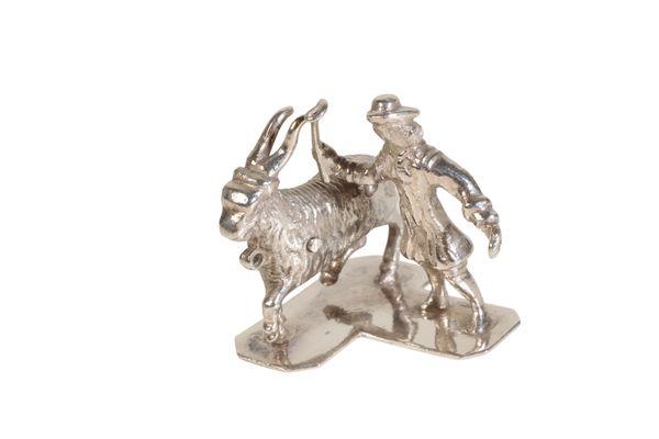 A DUTCH SILVER MINIATURE OF A SHEPHEARD LEADING A GOAT