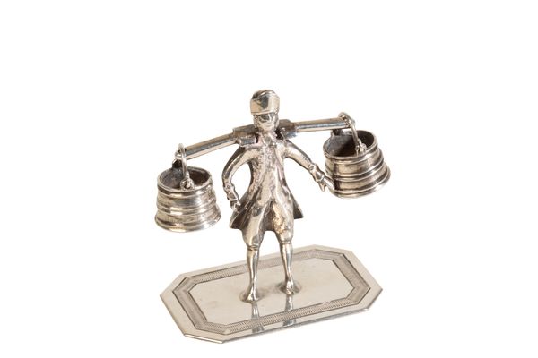 A DUTCH SILVER MINIATURE OF A WATER CARRIER