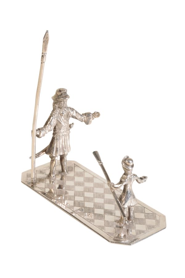 A DUTCH SILVER MINIATURE OF A GUARDSMAN AND CHILD