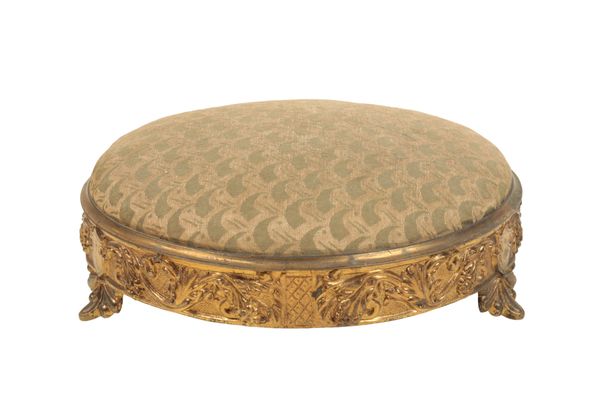 AN EARLY VICTORIAN REPOUSSE ORMOLU AND UPHOLSTERED FOOTSTOOL,