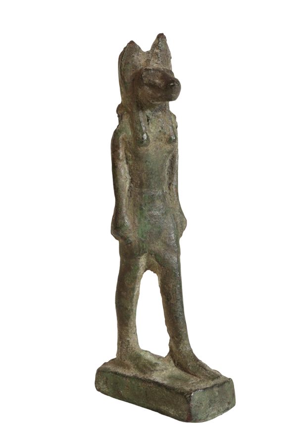 AN EGYPTIAN BRONZE MODEL OF ANUBIS,