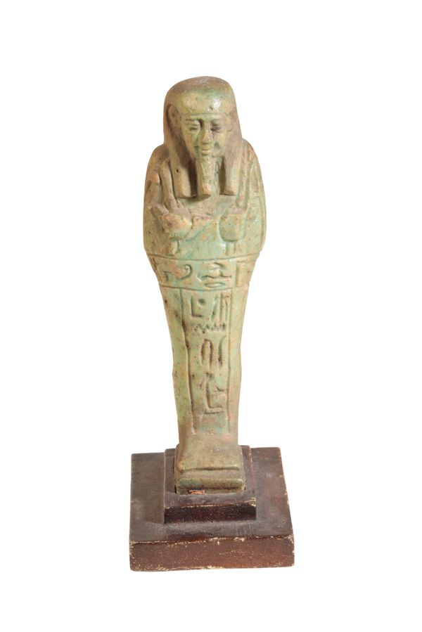 AN EGYPTIAN TURQUOISE GLAZED FAIENCE SHABTI FIGURE,