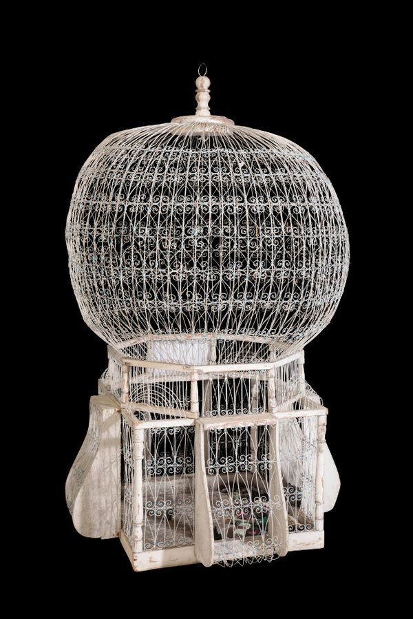 A CONTINENTAL WHITE PAINTED SOFTWOOD AND WIREWORK BIRD CAGE,