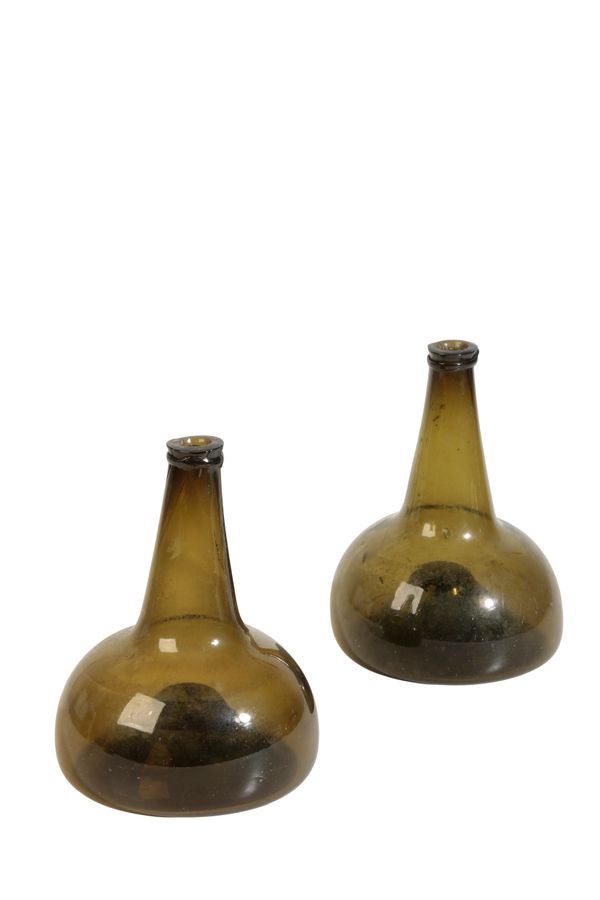 A PAIR OF ENGLISH GLASS WINE BOTTLES, 18TH CENTURTY